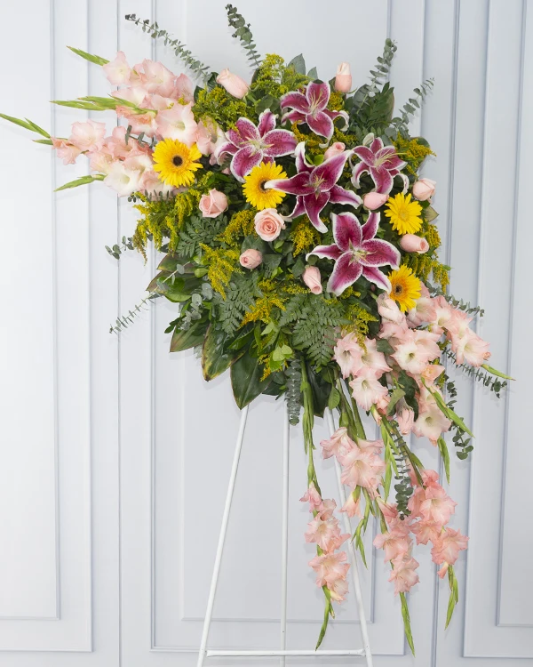 Corona fúnebre grande de rosas y gladiolos